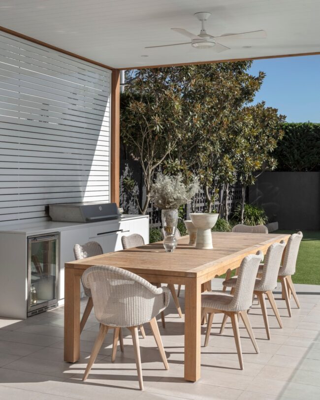 Outdoor Dining Space Featuring Built-In Grill