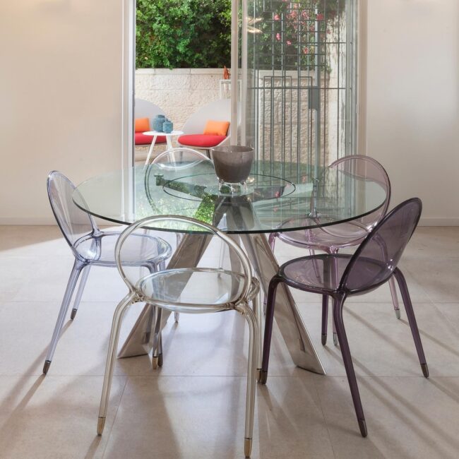 Sleek Glass Dining Table with Clear Chairs