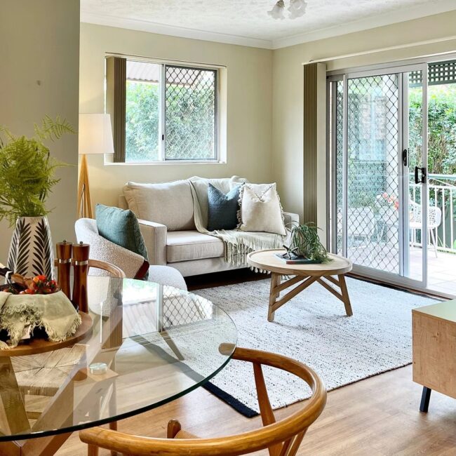 Cozy Living Area Featuring a Glass Coffee Table