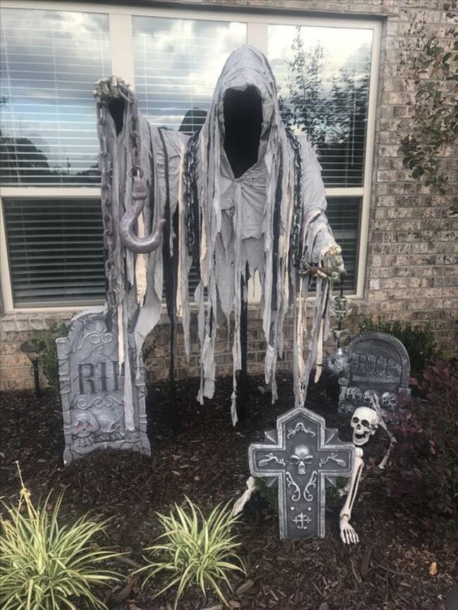 Reaper Statue with Chains and Tombstones