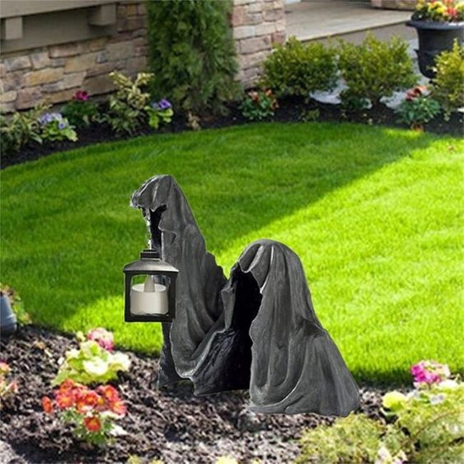 Haunting Hooded Figures in the Yard