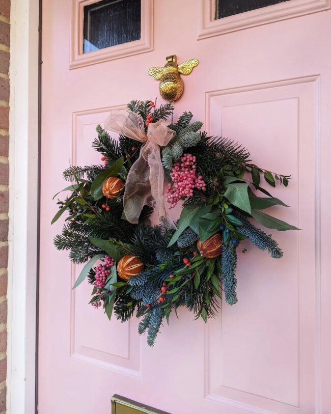 A Cheerful Holiday Wreath with Pink Accents