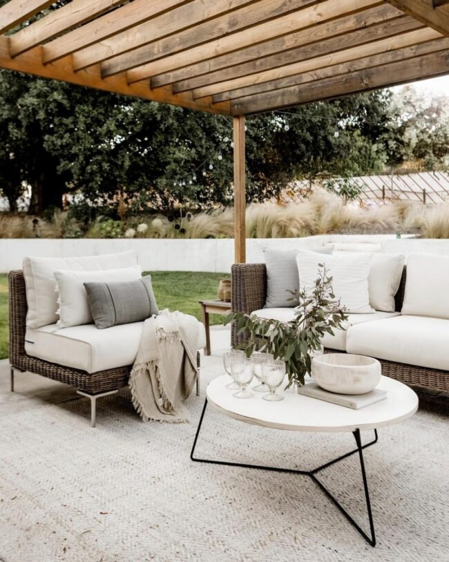 Charming Neutral Patio Featuring Wooden Pergola