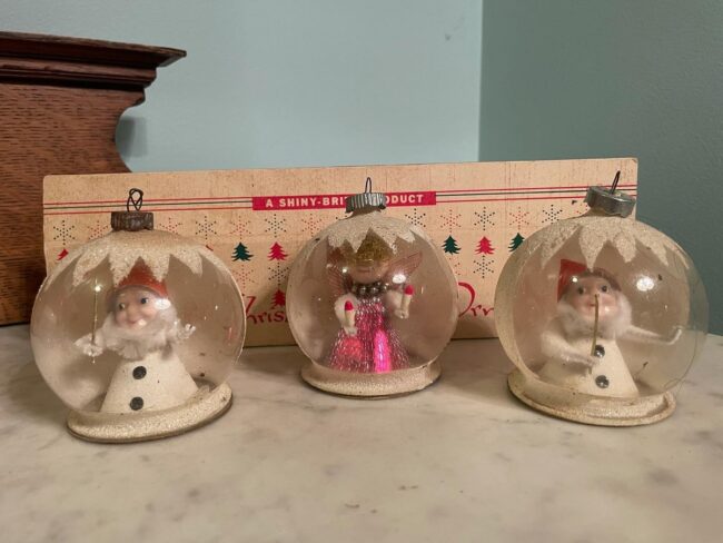 Cute Holiday Figures in a Snow Globe Scene