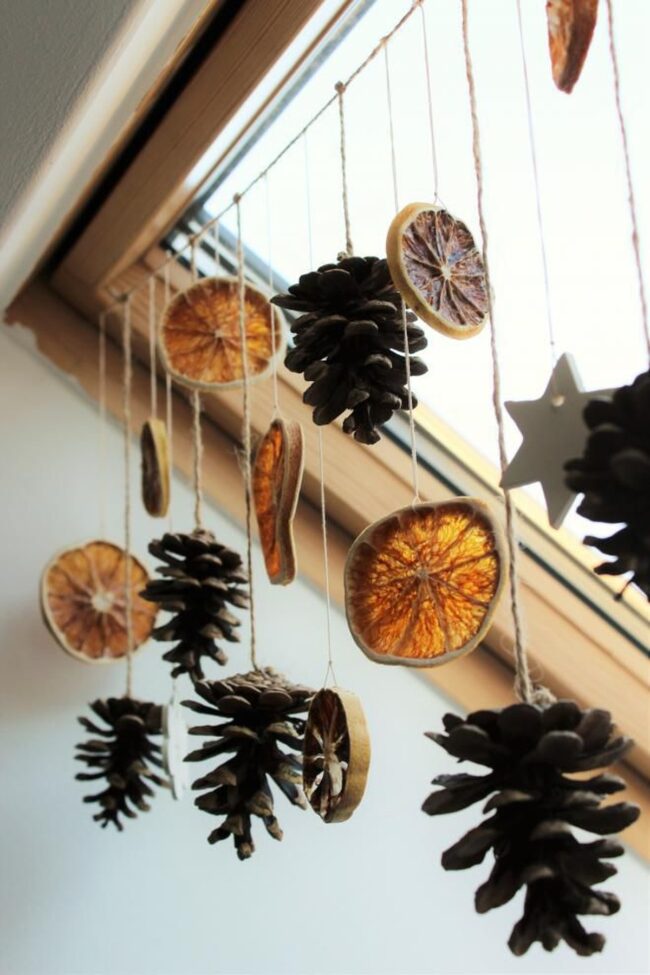 A Hanging Garland with Pinecones & Citrus Accents