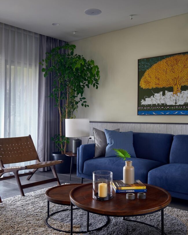 Urban Oasis with Blue Sofas and Natural Tones