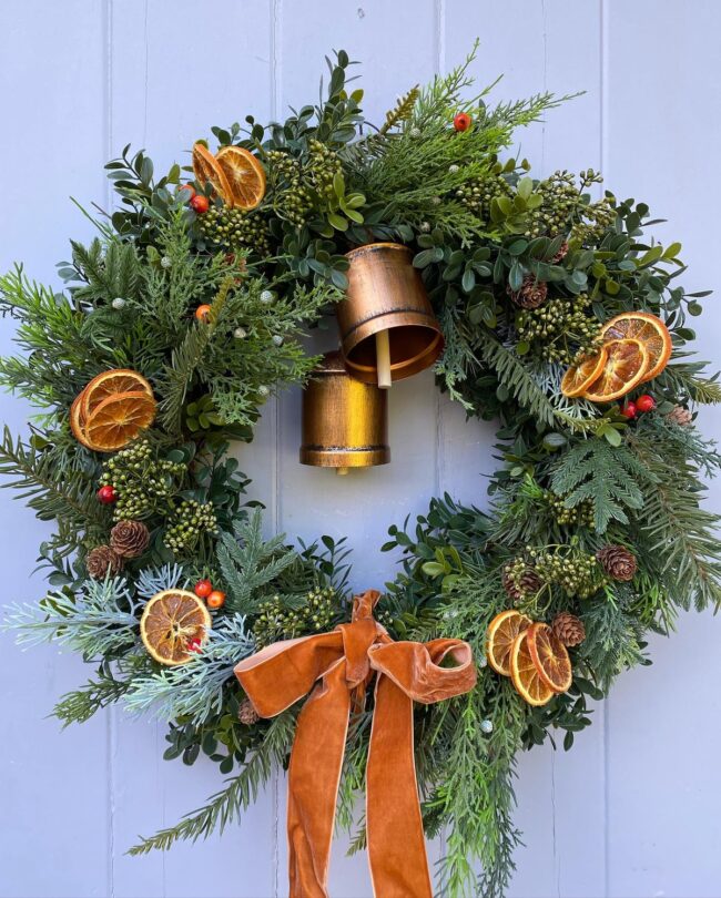 A Rustic Wreath with Bells & Citrus Accents