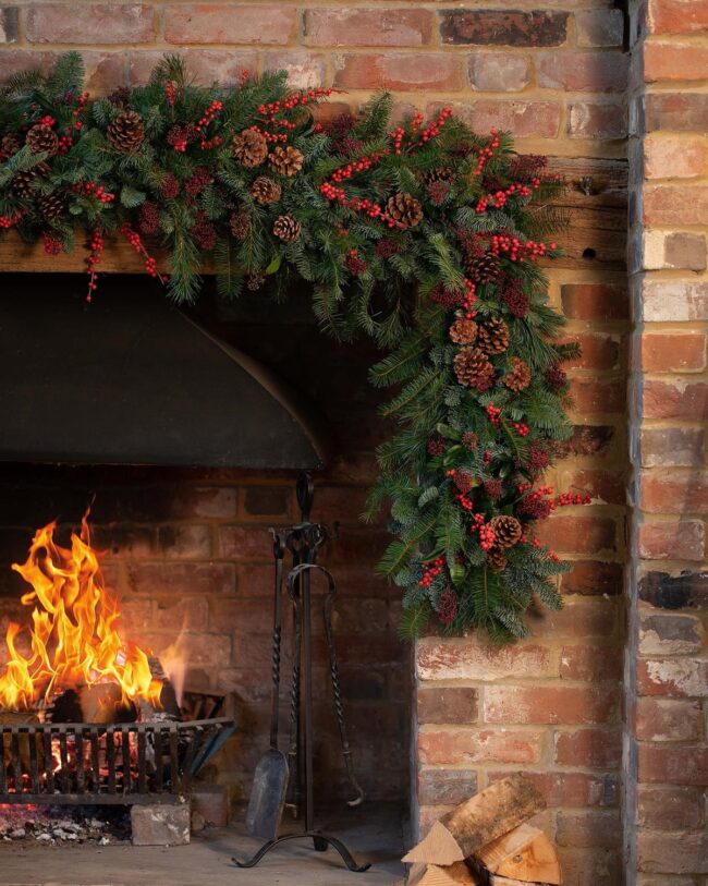 A Classic Fireplace with Holiday Greenery